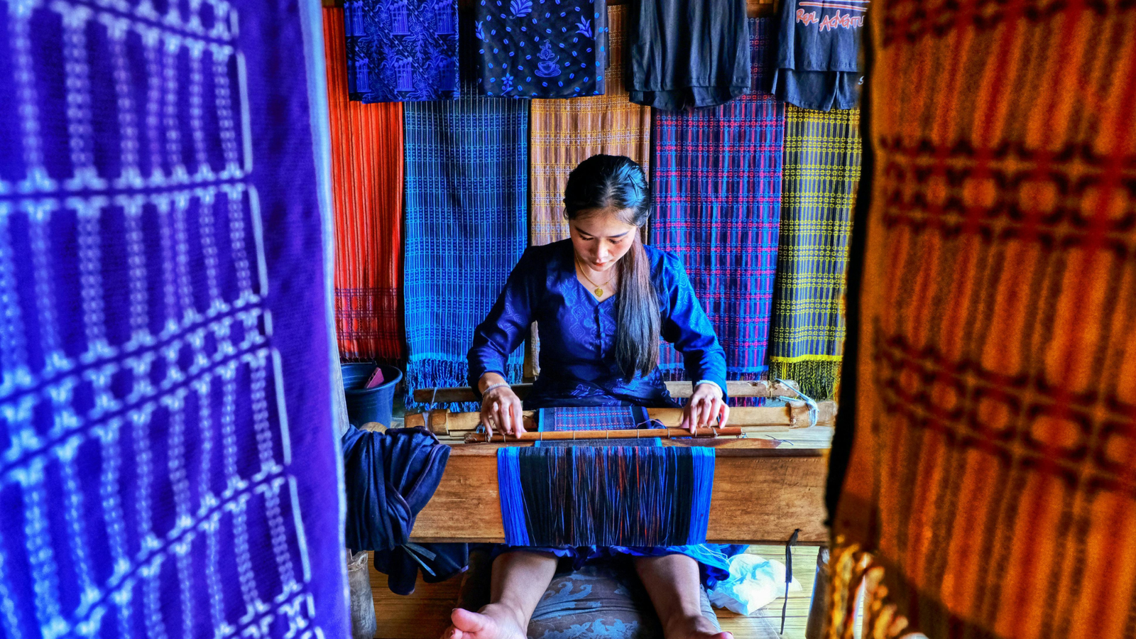 Traditional Thai silk weaving on a wooden handloom