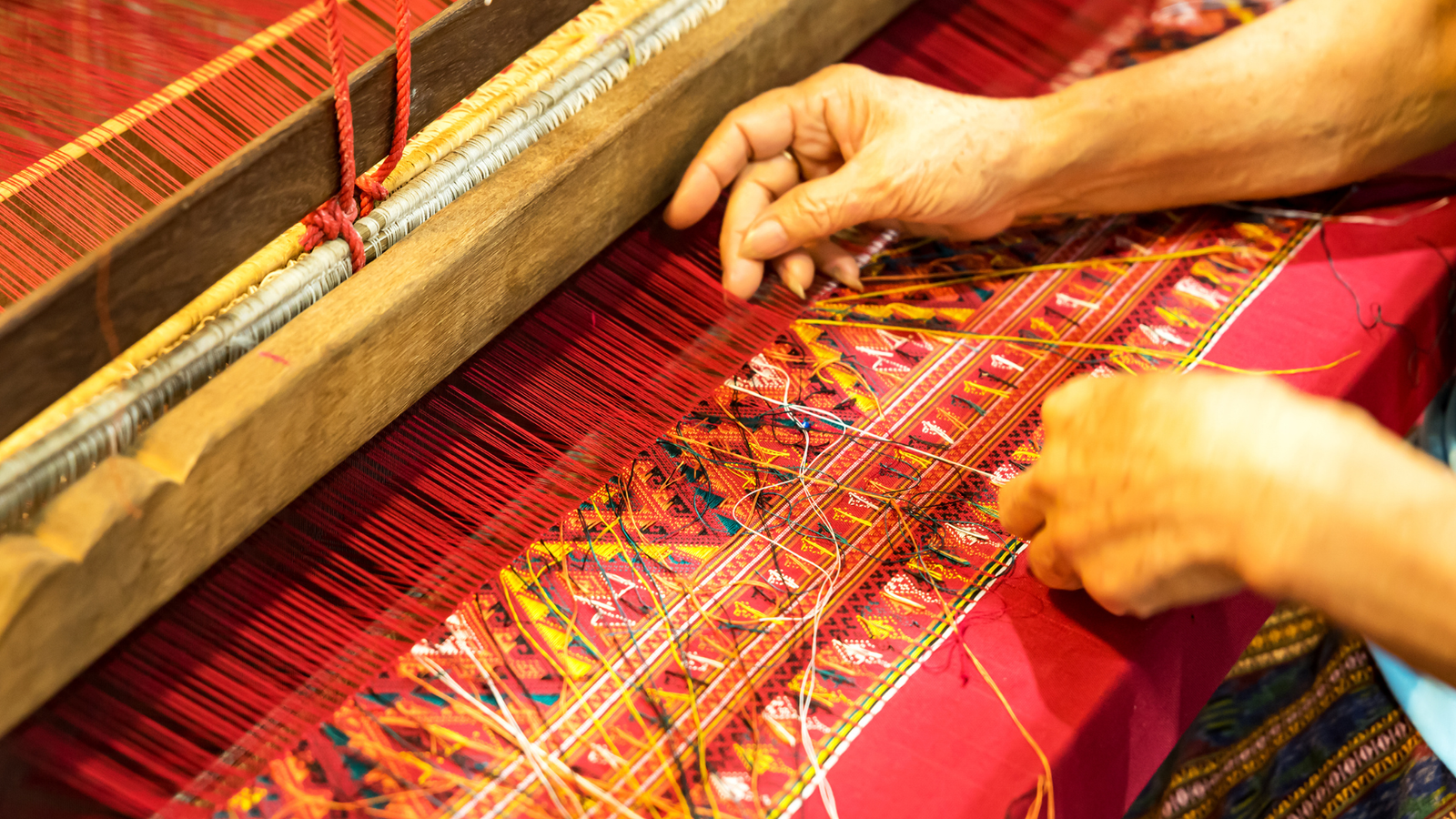Colourful Thai silk fabric with intricate traditional patterns